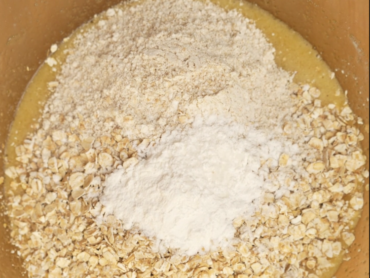 Add-both-oats-baking-powder-and-salt.-Stir-until-the-dough-comes-together