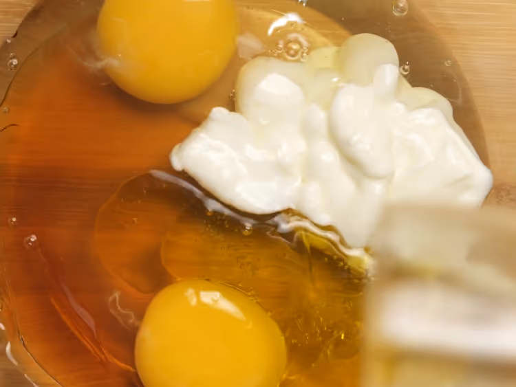 In-a-large-bowl-whisk-together-eggs-yogurt-honey-or-maple-syrup-olive-oil-and-vanilla-until-smooth