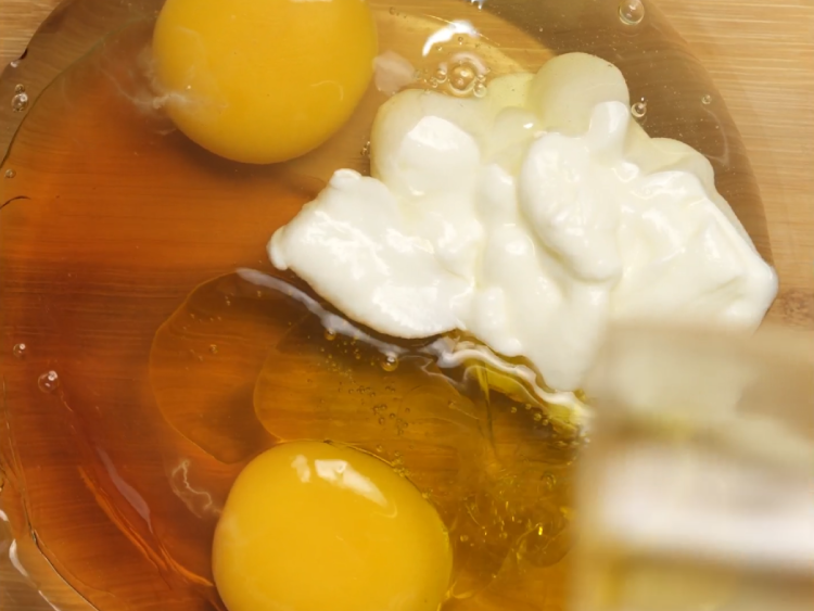 
In-a-large-bowl-whisk-together-eggs-yogurt-honey-or-maple-syrup-olive-oil-and-vanilla-until-smooth