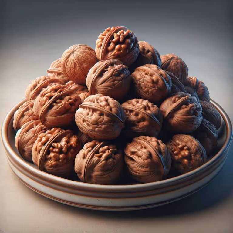 A pile of fresh walnuts on a plate, representing heart healthy snacks rich in omega-3 fatty acids and unsaturated fats that support cardiovascular health