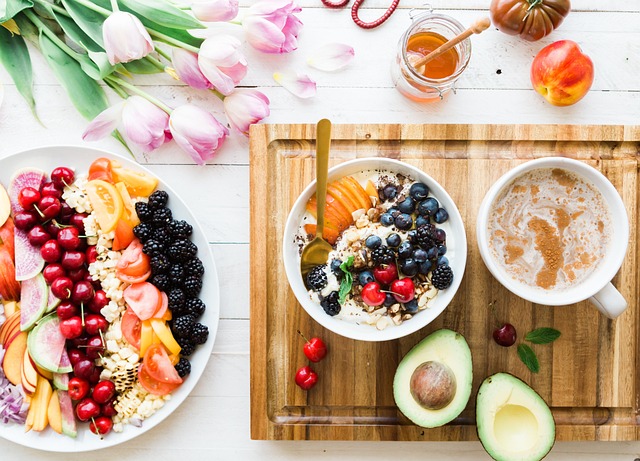 A healthy breakfast bowl with fresh fruit, yogurt and granola, representing a wholesome make-ahead breakfast like peach baked oatmeal