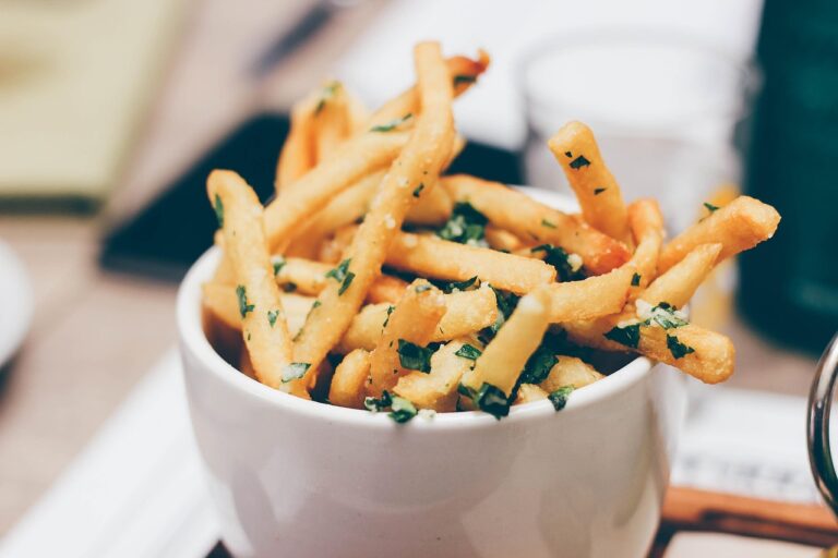 Bowl of french fries, a common ultra-processed food that can drive weight gain through mechanisms beyond calorie content including hunger hormone disruption and gut microbiome changes.