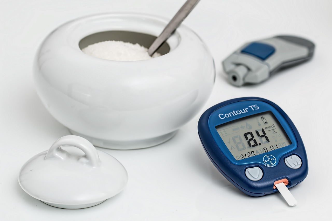 Blood glucose test showing a finger prick glucometer and test strips, representing the importance of proper insulin resistance testing for women with PCOS