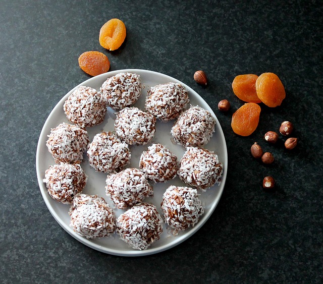 Homemade oatmeal and coconut energy balls arranged on a plate, a healthy no-bake snack made with oats, coconut, and nuts