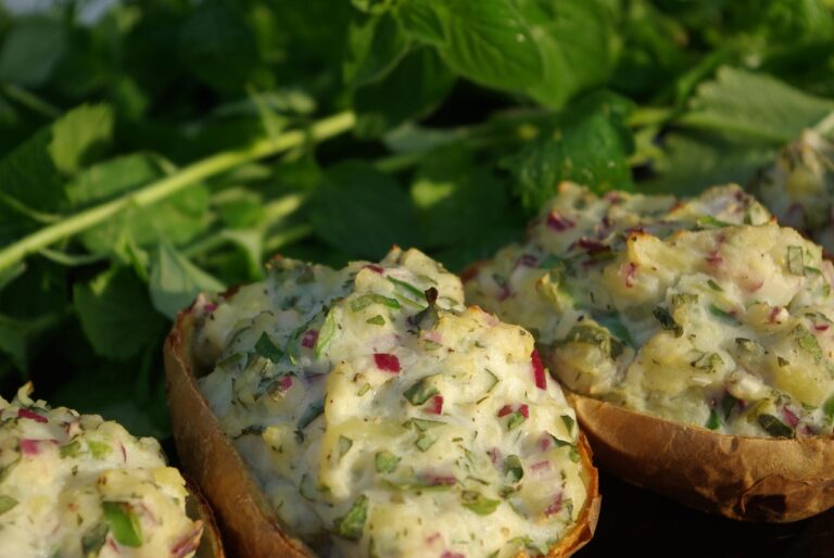 Stuffed baked potato with fillings on a plate, a healthy cholesterol-lowering lunch option rich in fiber