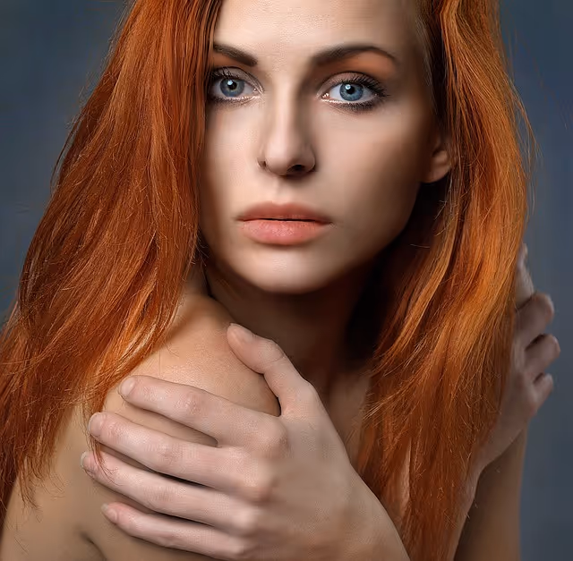 Young woman with beautiful long red hair, representing the beauty-from-within results of proper nutrition and key nutrients for healthy hair