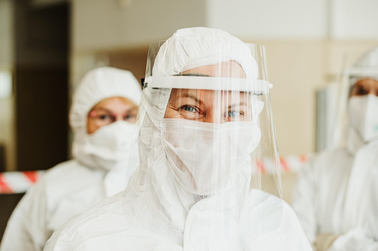 Healthcare professional wearing face mask and face shield, representing hospital infection prevention and patient safety measures