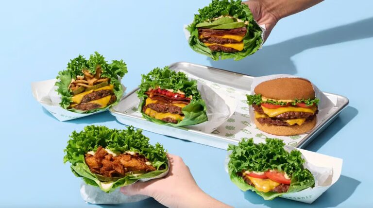 Shake Shack ShackBurger Lettuce Wrap burgers on a tray, part of the Good Fit Menu with high-protein, low-carb lettuce-wrapped options
